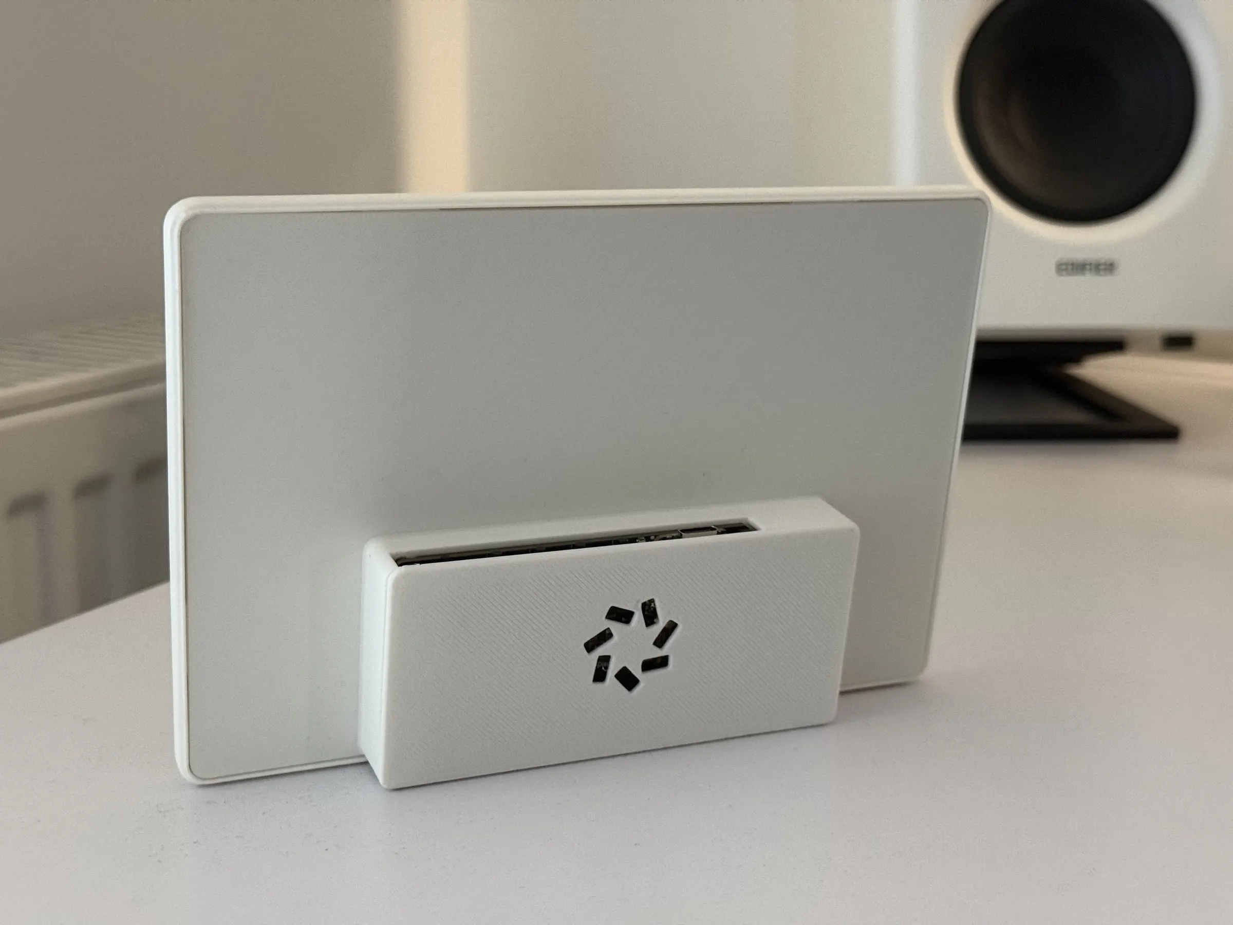 The back of the case: a flat white panel with the box for the board and battery at the bottom